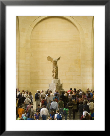 Interior Of The Louvre Museum Showing Winged Victory Statue And Tourists, Paris, France by Jim Zuckerman Pricing Limited Edition Print image