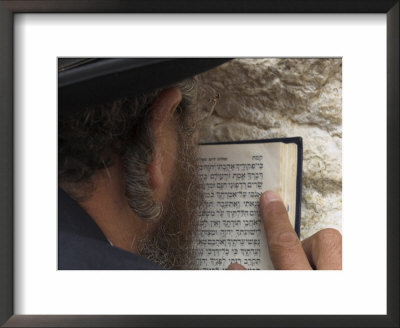 An Orthodox Jew Holding Prayer Book Against The Wall And Praying, Western Wall, Jerusalem, Israel by Eitan Simanor Pricing Limited Edition Print image