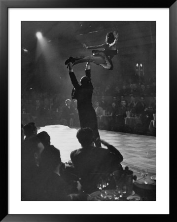 Can Can Dancer Held Up In The Air By A Performing Gentleman At The Paris Show by Nat Farbman Pricing Limited Edition Print image
