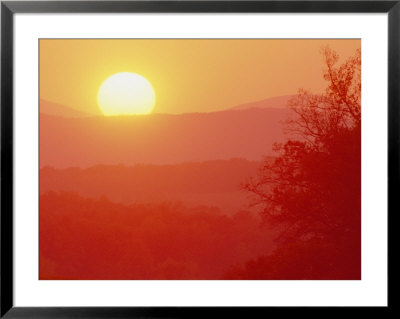 A Large Sun Setting Over The Landscape by Kenneth Garrett Pricing Limited Edition Print image