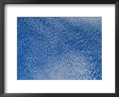 A View Of The Sky Filled With Cottonball Clouds by Todd Gipstein Pricing Limited Edition Print image