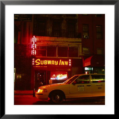 Taxi Passing A Neon Lit Bar, New York City, United States Of America by Corey Wise Pricing Limited Edition Print image