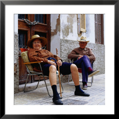 Elderly Couple Relaxing Outside Their House, Palma De Mallorca, Spain by Christian Aslund Pricing Limited Edition Print image