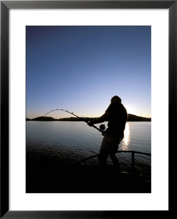 An Angler Fights A Large Halibut, Prince William Sound, Alaska, Usa by Hugh Rose Pricing Limited Edition Print image