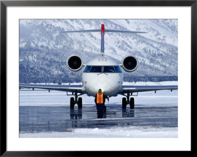 Aircraft At Jackson Hole Airport Surrounded By Snow-Covered Fields And Hills, Jackson Hole, Wyoming by Richard Cummins Pricing Limited Edition Print image