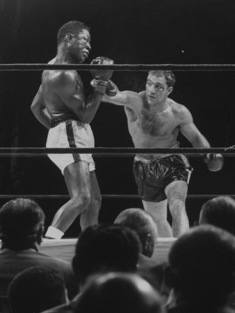 Boxers Rocky Marciano And Charles Ezzard Boxing One Another For The Heavyweight Championship by Ralph Morse Pricing Limited Edition Print image