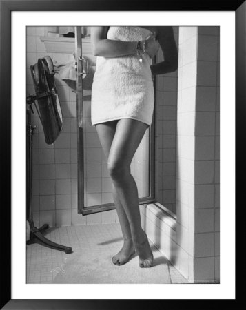 Betty Grable's Famous Legs As She Stands Wrapped In A Towel In Front Of Her Shower by Walter Sanders Pricing Limited Edition Print image