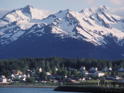 View Of Haines, With The Coastal Town In Front Of Snowy Mountains, Haines, Alaska by Stephen Sharnoff Pricing Limited Edition Print image