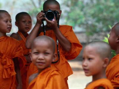 Novice Monks Learning Workings Of Camera, Mae Hong Son, Thailand by Alain Evrard Pricing Limited Edition Print image