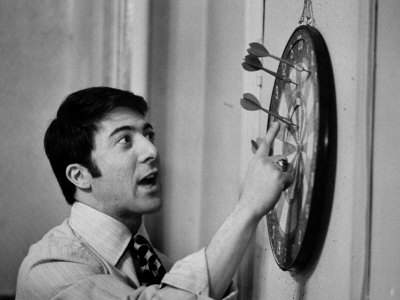 Actor Dustin Hoffman Playing Darts by John Dominis Pricing Limited Edition Print image