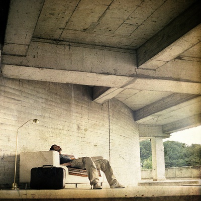 A Young Man Resting On A Sofa by Jewgeni Roppel Pricing Limited Edition Print image