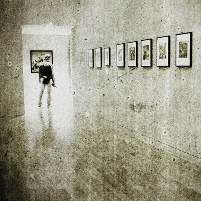 A Young Man Standing In A Gallery by Jewgeni Roppel Pricing Limited Edition Print image