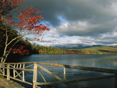 Cloud-Filled Sky And Autumn Hues Around Lake Chocorua by Tim Laman Pricing Limited Edition Print image