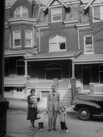 Junior High School English Teacher Joseph Barrett And His Family Standing In Front Of Their House by Nina Leen Pricing Limited Edition Print image