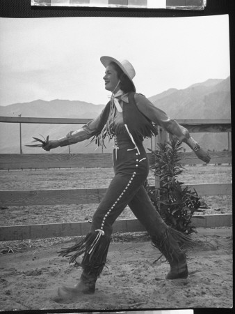 Model Wearing Skin-Tight Frontier Pants Of Light Blue Suede, Designed By Marge Riley, Dude Ranch by Peter Stackpole Pricing Limited Edition Print image