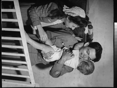 Bill Mauldin Hugging His Son Bruce Patrick As His Wife Watches On His 1St Day Home From The War by Martha Holmes Pricing Limited Edition Print image