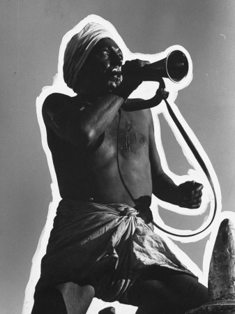 Actor Sam Jaffe, Blowing A Bugle In A Scene From The Motion Picture Gunga Din by Peter Stackpole Pricing Limited Edition Print image