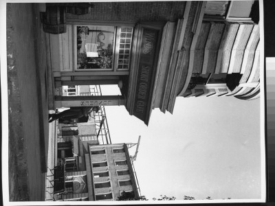 Writer Damon Runyon Standing Outside Restaurant On 20Th Century Fox Lot by Gjon Mili Pricing Limited Edition Print image