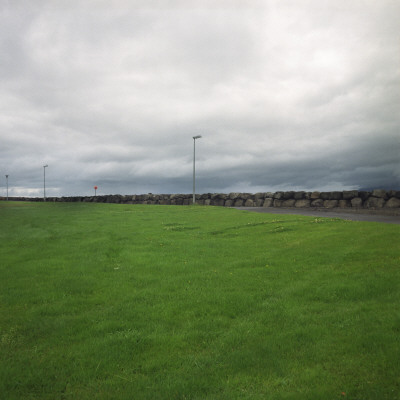 Green Grass, A Foot Path And A Stone Fence, Iceland by Atli Mar Pricing Limited Edition Print image