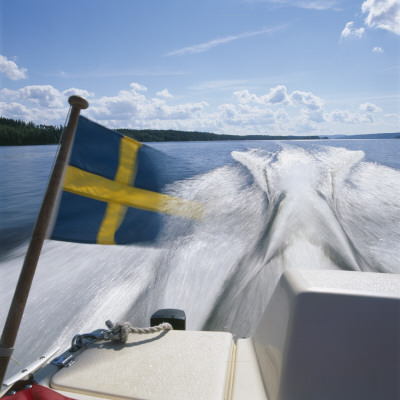 A Speedboat With The Swedish Flag by Ove Eriksson Pricing Limited Edition Print image