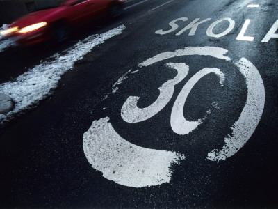 A Speed Limit Sign On The Street By A School In Sweden by Jens Olof Lasthein Pricing Limited Edition Print image