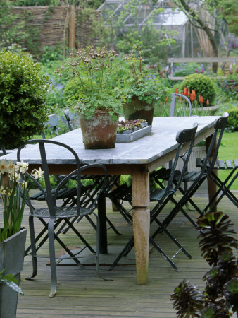 Decked Terrace With Lead Table And Chairs, Designer: Lisette Pleasance by Clive Nichols Pricing Limited Edition Print image