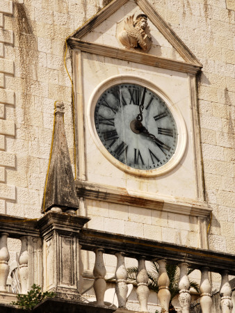 Intricate Clock And Carving On The Palace Hotel In Hvar, Dalmatian Coast, Croatia by Olwen Croft Pricing Limited Edition Print image