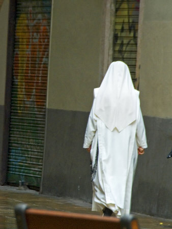 Nun, Seen From Behind, In A White Habit, Walks On A Street by Stephen Sharnoff Pricing Limited Edition Print image