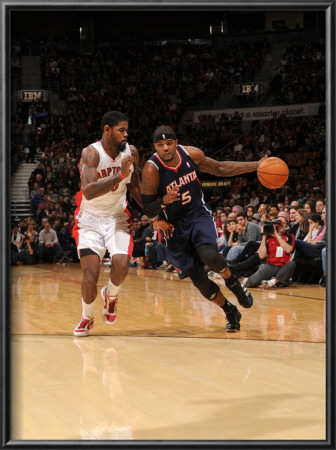 Atlanta Hawks V Toronto Raptors: Josh Smith And Amir Johnson by Ron Turenne Pricing Limited Edition Print image