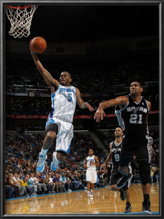 San Antonio Spurs V New Orleans Hornets: Marcus Thornton And Tim Duncan by Layne Murdoch Pricing Limited Edition Print image