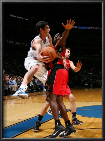 Toronto Raptors V Washington Wizards: Kirk Hinrich And Reggie Evans by Ned Dishman Pricing Limited Edition Print image