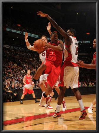 Houston Rockets V Toronto Raptors: Kyle Lowry And Amir Johnson by Ron Turenne Pricing Limited Edition Print image