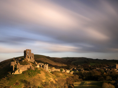 Corfe Castle And Corfe Village, Late Evening Light, Dorset, Uk. November 2008 by Ross Hoddinott Pricing Limited Edition Print image