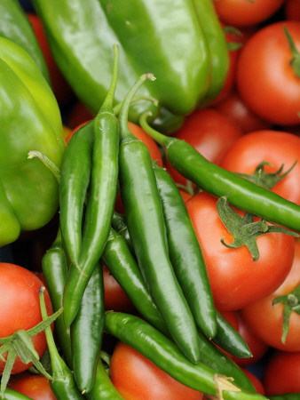 Close Up Shot Of Home Grown Greenhouse Harvest Of Sweet Peppers, Chilli Peppers And Tomatoes, Uk by Gary Smith Pricing Limited Edition Print image