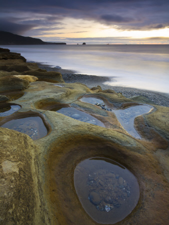 Sandstone Rock Formations On Seven Mile Beach, South Island, New Zealand by Adam Burton Pricing Limited Edition Print image
