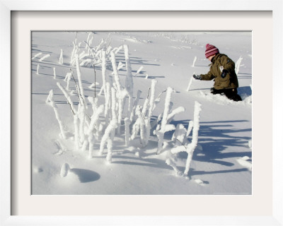A Young Boy Wades Through The Deep Snow by Christof Stache Pricing Limited Edition Print image