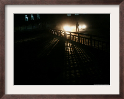An Afghan Street Sweeper Works The Last Hours Of The Day by Rodrigo Abd Pricing Limited Edition Print image