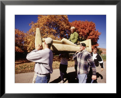 College Students Moving Couch With Student On It by Stewart Cohen Pricing Limited Edition Print image