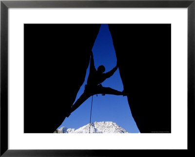 Silhouette Of Man Rock Climbing On Split Rock, Ca by Greg Epperson Pricing Limited Edition Print image