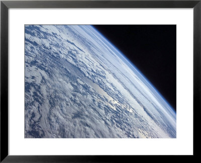 Earth's Horizon Against The Blackness Of Space by Stocktrek Images Pricing Limited Edition Print image