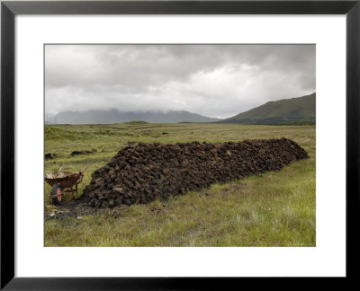 Cut Peat Stacked Up For Winter, Connemara, County Galway, Connacht, Republic Of Ireland by Gary Cook Pricing Limited Edition Print image