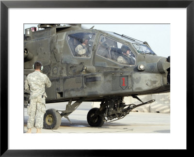 Ah-64 Apache Preparing To Leave Its Pad For A Mission by Stocktrek Images Pricing Limited Edition Print image