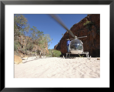 Helicopter On Sand At Bullo River Station, Near Kununurra, Northern Territory, Australia by Michael Gebicki Pricing Limited Edition Print image