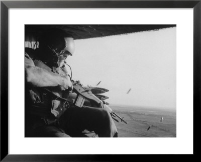 Us Military Personnel Firing From Helicopters Onto Viet Cong Targets by Larry Burrows Pricing Limited Edition Print image
