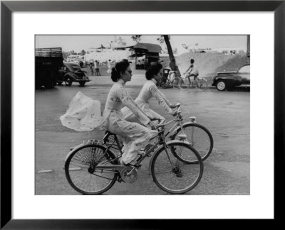 Women Riding Bicycles In Saigon by John Dominis Pricing Limited Edition Print image
