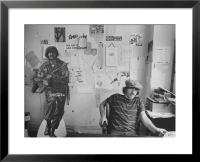 Editor Of Chicago Underground Newspaper John Walrus Sitting In Office by Lee Balterman Pricing Limited Edition Print image