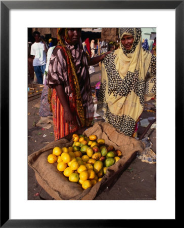 Women With Wheelbarrow Of Lemons At Local Market, Djibouti, Djibouti by Mason Florence Pricing Limited Edition Print image