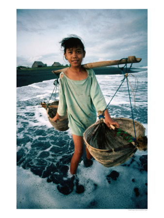 A Girl Gathers Salt Water In Lontar Leaf Buckets For Salt Making, Kusamba, Indonesia by Gregory Adams Pricing Limited Edition Print image