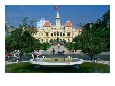 People Riding Bikes Past Fountain And Town Hall, Ho Chi Minh City, Ho Chi Minh, Vietnam by Anders Blomqvist Pricing Limited Edition Print image