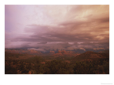 Cathedral Rock In Distance Menaced By Storm Clouds And Lightning Bolt by Todd Gipstein Pricing Limited Edition Print image